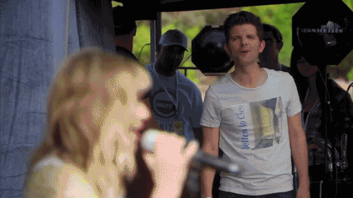 Gif from Parks & Recreation of Ben Wyatt shouting "I love you, Kay Hanley!" to the lead singer of Letters To Cleo. She winks in return. Ben does his best Andy Dwyer "dumb impressed" face.